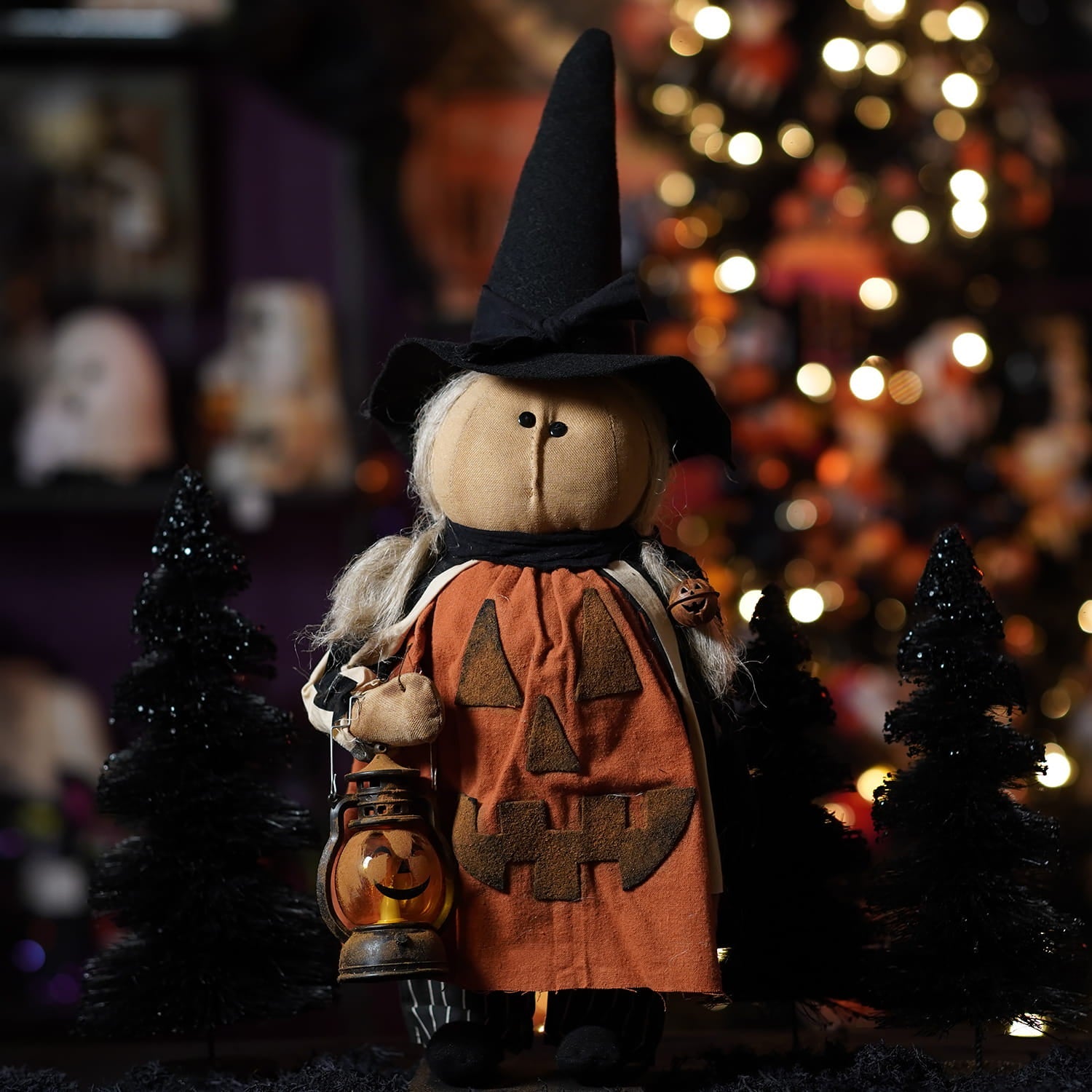 Handcrafted large orange pumpkin-faced witch doll wearing black pointed hat holding lantern perfect figural decor