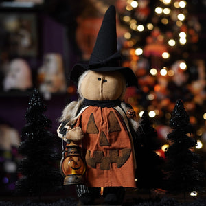 Handcrafted large orange pumpkin-faced witch doll wearing black pointed hat holding lantern perfect figural decor