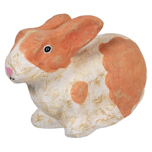 Orange and white ceramic rabbit figurine.