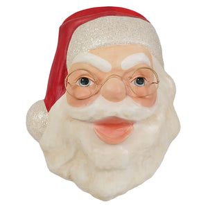 A cheerful handcrafted retro santa wall ornament with a red hat, glittery white trim, gold glasses, and detailed beard