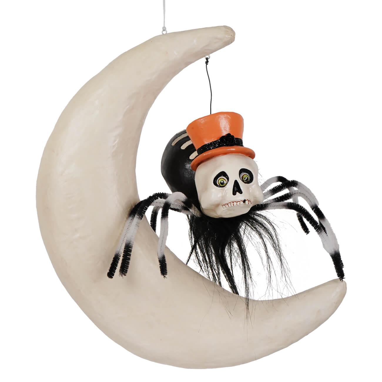 A whimsical halloween spider on moon decoration with black and white pipe cleaner legs and an orange glitter hat