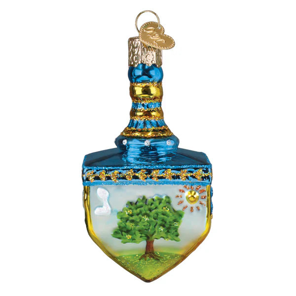 Blue and gold glass dreidel ornament with painted green tree sun and white cloud scene perfect for figural decor or tree toppers
