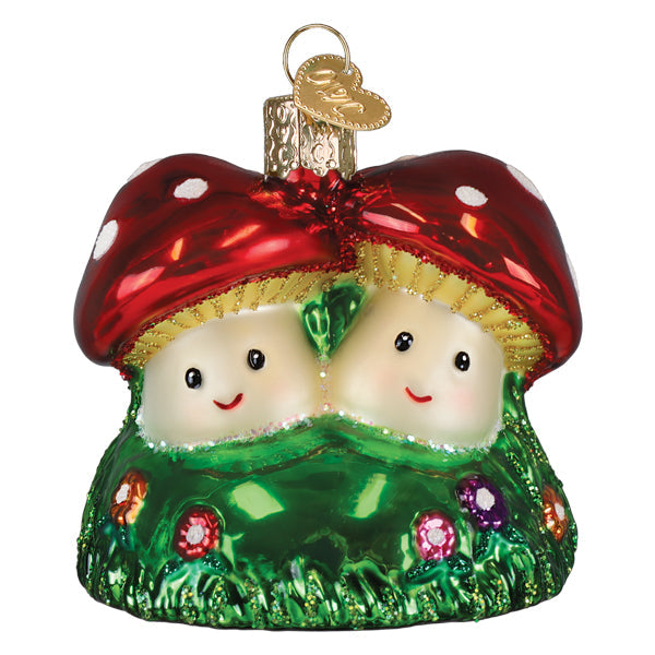 Happy mushrooms ornament with red and white polka-dotted glass mushroom house on green glittery grass base christmas glass ornament