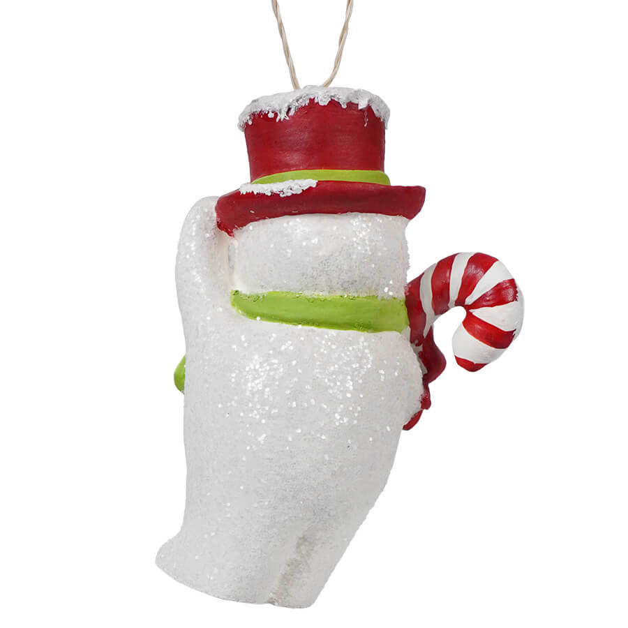 White snowman ornament wearing a red top hat and holding a candy cane.