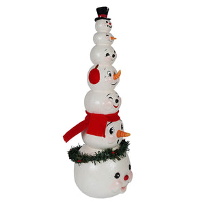 A charming white snowman tower figurine with five smiling faces wearing a red scarf and black top hat christmas snowman decor