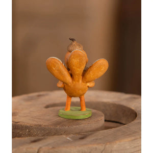 A charming orange turkey figure with acorn on head on green base by michelle lauritsen design bethany lowe thanksgiving