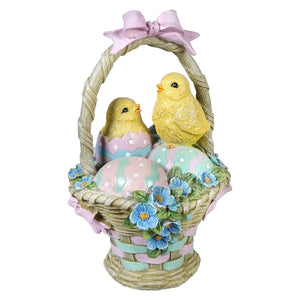 Easter basket with hatching chicks and colorful decorated eggs perfect for easter and spring tabletop decor