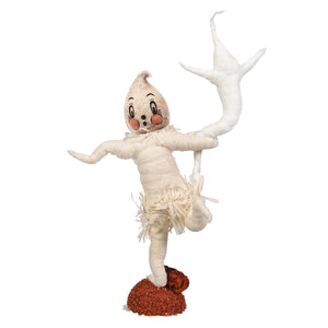 A whimsical white spun cotton halloween ghost figurine with rosy cheeks and a fringed skirt by johanna parker
