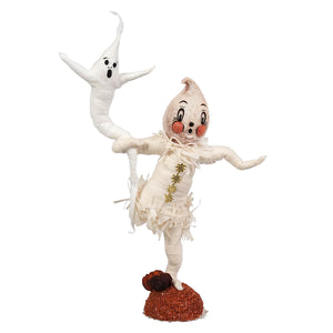 A whimsical white spun cotton halloween ghost with rosy cheeks and star outfit on orange base by johanna parker figural decor