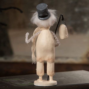 A whimsical white snowman figurine with black top hat holding crocheted scarf and lantern in haunting henry halloween ghost figures decor