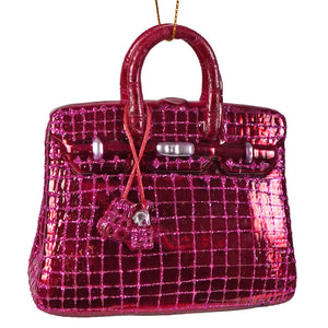 Haute handbag glass ornament in shiny fuchsia with glitter, crocodile texture, and silver hardware luxury handbag ornament