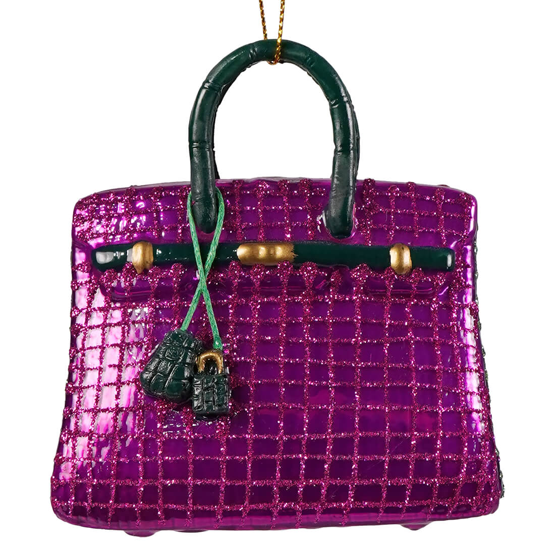 Haute handbag glass ornament featuring a glittery purple luxury handbag with dark green handles and gold-tone hardware