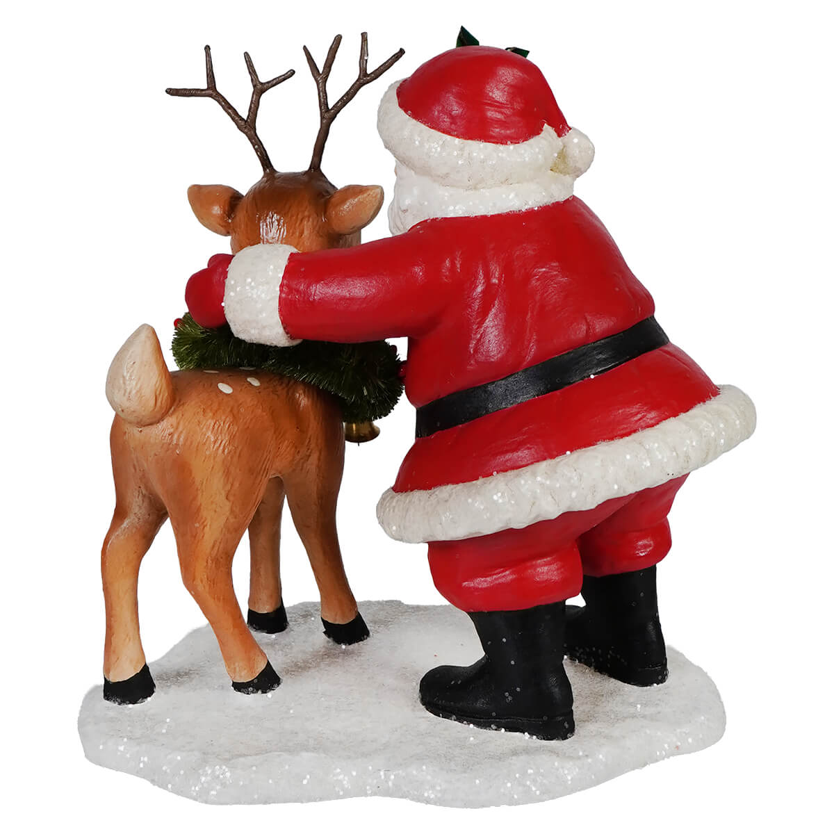 Red and white santa figure hugging a brown reindeer with green garland perfect folk art santas santa with rudolph