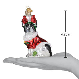 A festive glass french bulldog ornament in black and white wearing a red and green santa outfit perfect as a pet ornament