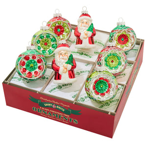 Set of eight holiday splendor decorated reflector glass ornaments in red green clear with floral patterns and santa figures