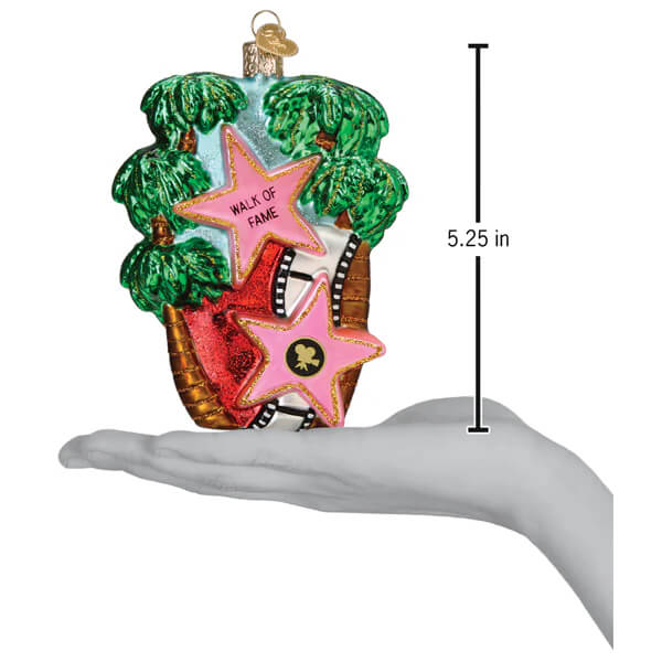 A vibrant hollywood walk of fame ornament glass ornament shaped like a star with pink red stars and palm trees background