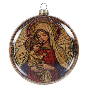 Stained glass style holy mother mary and child nativity glass disc ornament with glittery gold and red robes on dark blue background