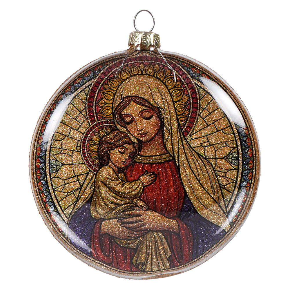 Stained glass style holy mother mary and child nativity glass disc ornament with glittery gold and red robes on dark blue background