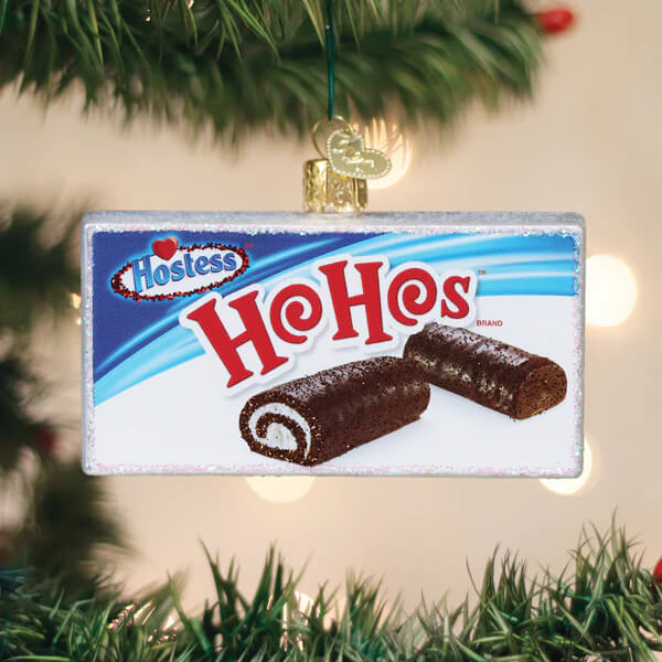 A rectangular glass christmas glass ornament shaped like a hostess hohos box with logo and chocolate roll cakes design