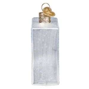 A translucent white glass hostess twinkies twinkies box ornament with glittery speckles and a gold hanger