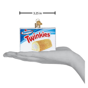 A miniature hostess twinkies box ornament with red and blue packaging and golden frosted cake roll for christmas decor