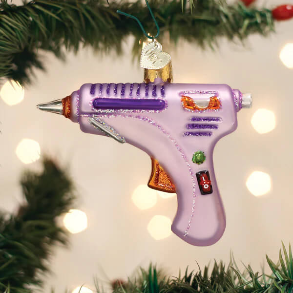 Hot glue gun ornament christmas glass ornament in purple and orange with glittery accents and detailed buttons