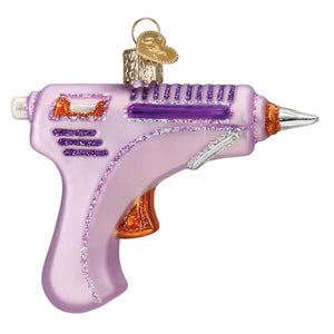 Pink and purple glittery glass hot glue gun ornament with orange accents and gold keychain loop christmas glass ornament