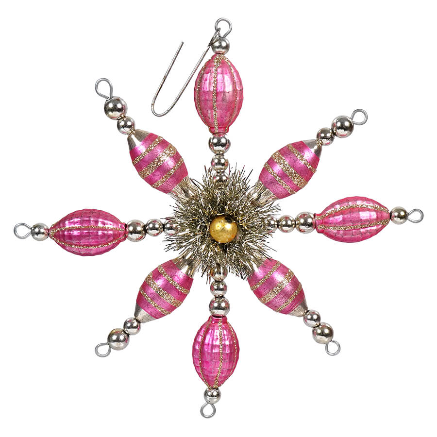 Ornate pink and silver snowflake-shaped Christmas ornament with beaded arms radiating from a central starburst.