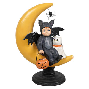 A glossy black bat-themed halloween figural decor of a child named hugh on a yellow moon with casper and pumpkin basket