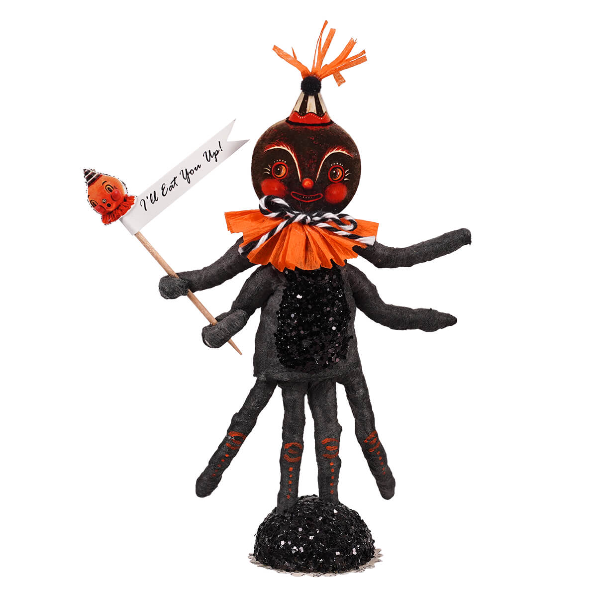 Black and orange halloween-themed spider figure with multiple arms legs orange frilly collar holding a sign ill eat you up
