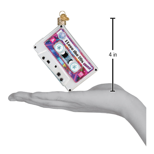 A clear glass christmas ornament shaped like a vintage cassette tape with an iridescent i love the 70s label perfect for world christmas and musical artists & instrument ornaments collections