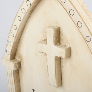 Beige wooden wall plaque with carved cross and circular motifs, perfect skeleton chunky sitter decor piece