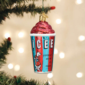 A red and blue glass icee ornament with glittery pink swirls and a cartoon bear in a santa outfit