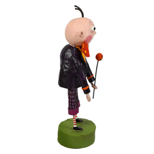 A lori mitchell halloween igor figurine with one eye wearing a black jacket holding an orange ball on a stick