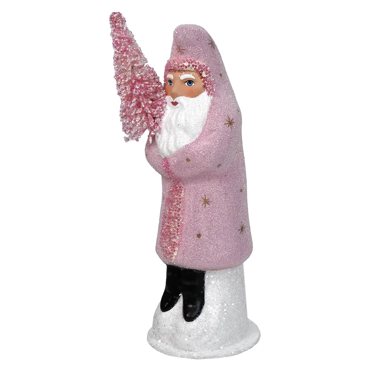 Pink-robed Santa Claus figurine holding a miniature Christmas tree.