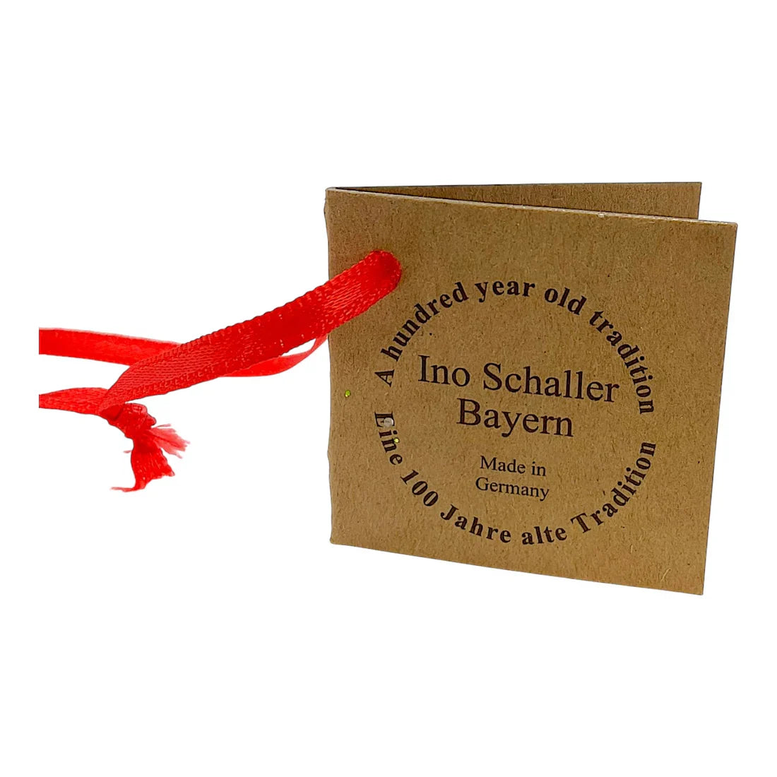 Brown kraft paper tag with black text and red ribbon on ino schaller brown paper mache sitting easter bunny gift