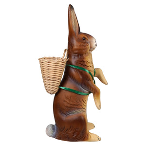Ino schaller brown standing easter bunny ceramic figurine with green ribbon wicker basket on its back