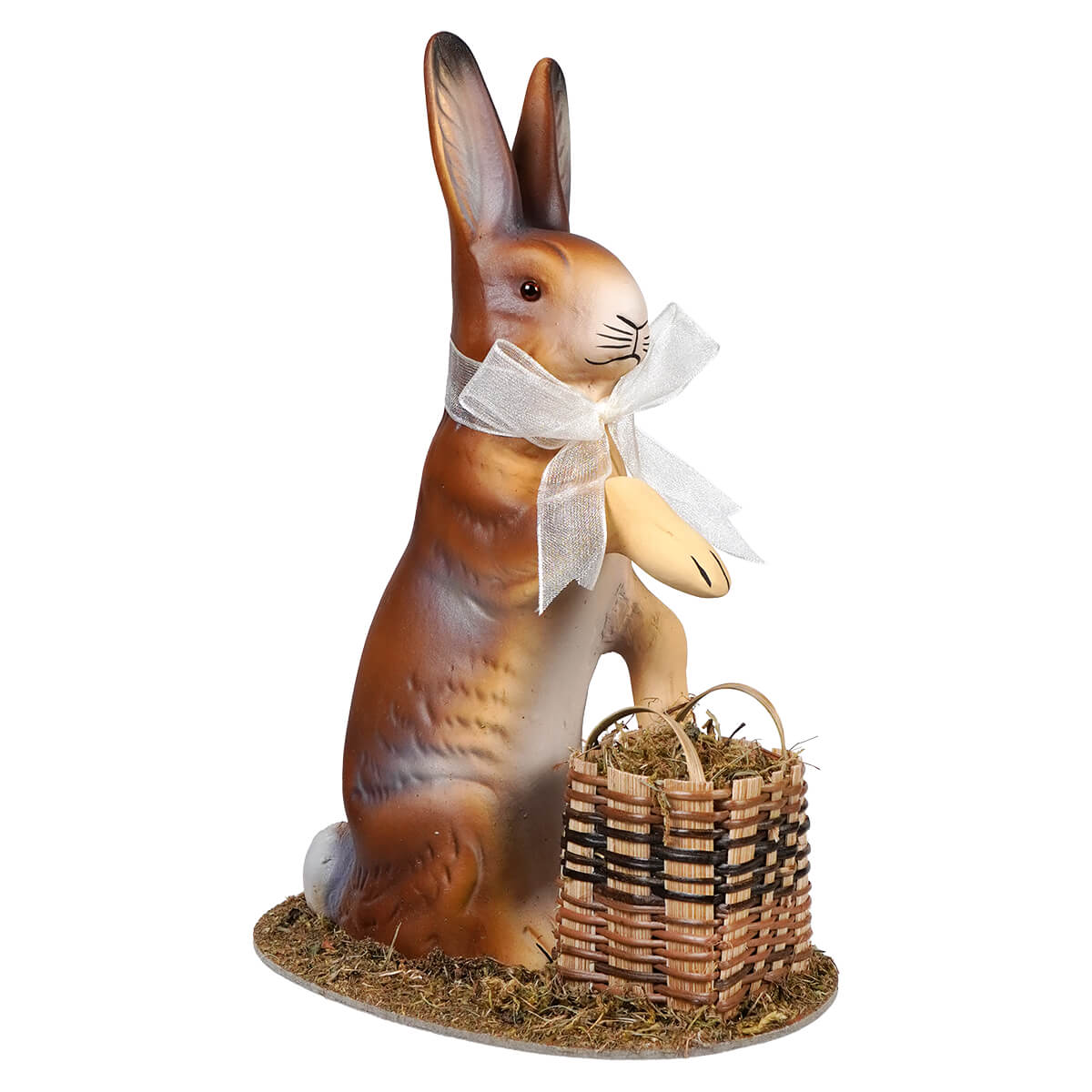 A charming ino schaller brown resin easter bunny holding a wicker basket with hay and wearing a white bow