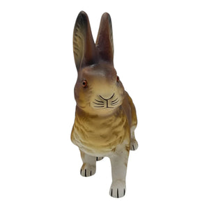 A detailed ino schaller walking easter bunny ceramic figurine with brown fur and red glass eyes made of paper mache