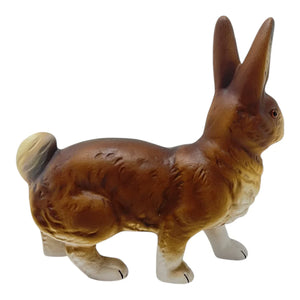 Brown walking easter bunny paper mache figurine by ino schaller with white-tipped paws and detailed fur texture