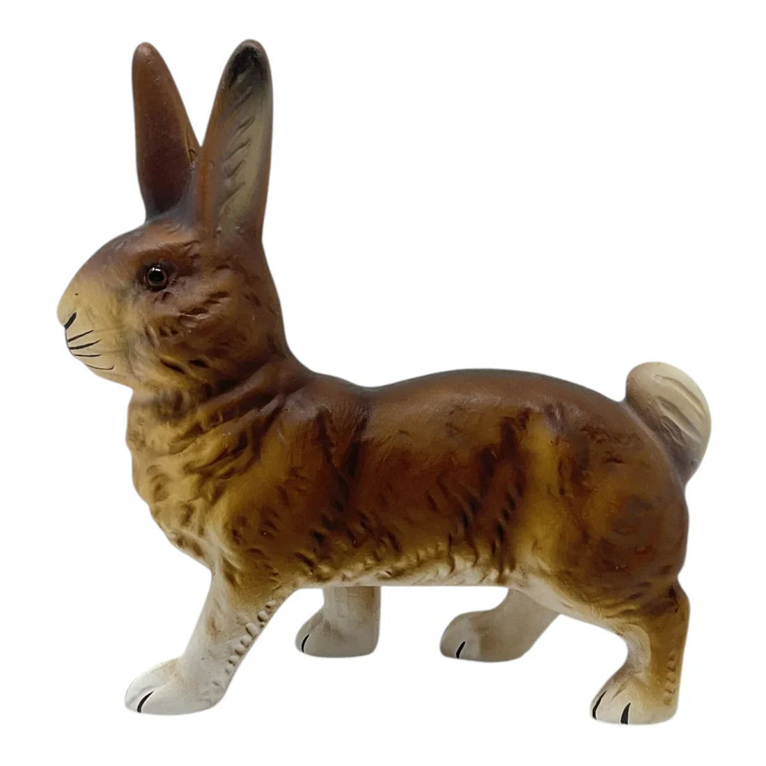 Detailed brown ino schaller paper mache walking easter bunny rabbit figurine with white tipped paws and textured fur surface