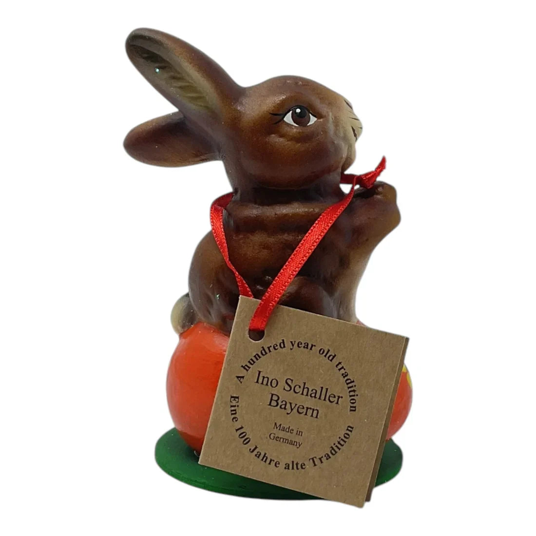 Brown ceramic ino schaller easter bunny with red ribbon on orange carrot base german paper mache figurine