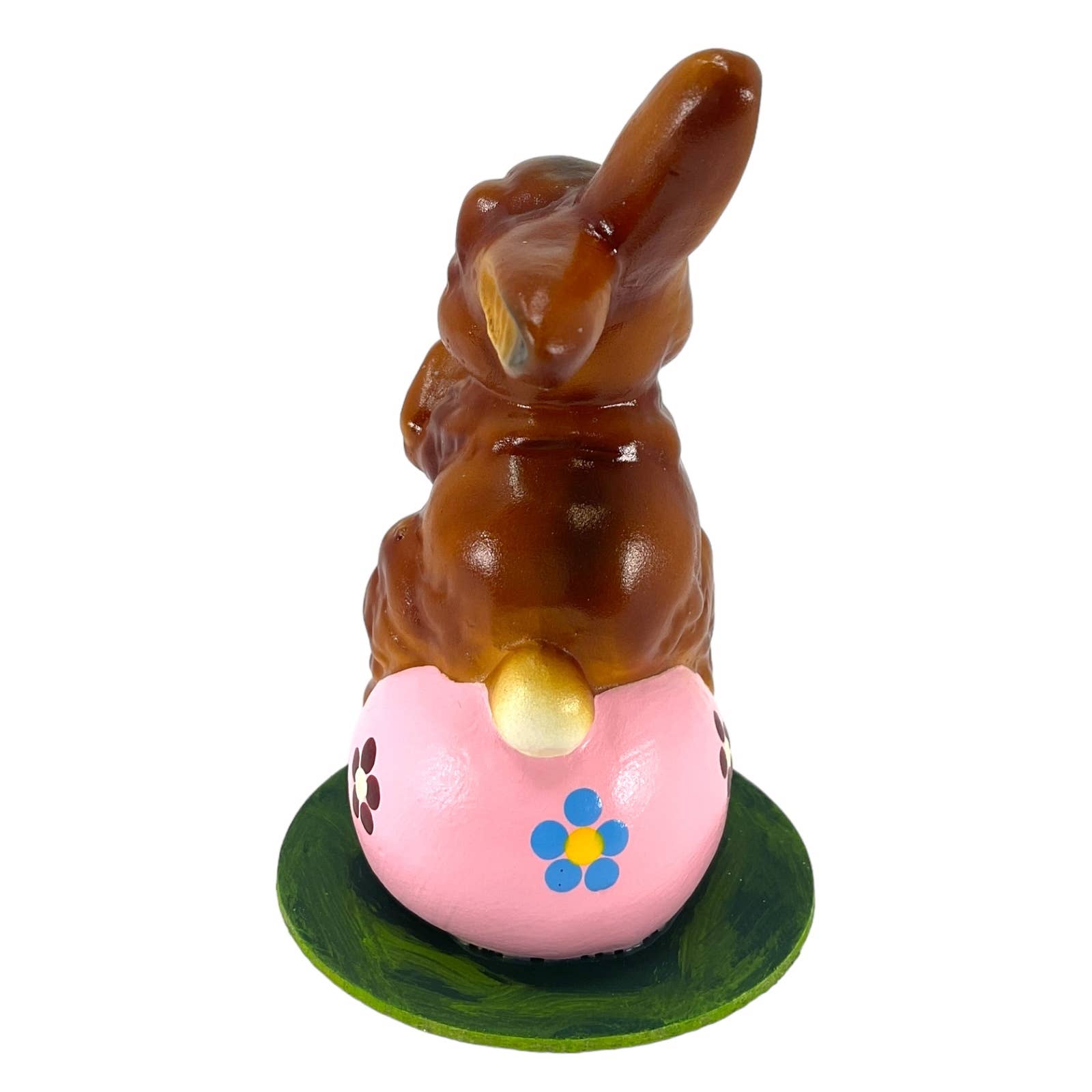 Glossy brown ino schaller easter rabbit figurine on hand-painted pink paper mache egg with blue and yellow flowers