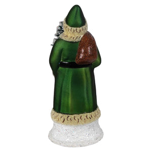 Green glass ino schaller santa holding frosted tree with glittery brown sack and cream fur trim in green coat