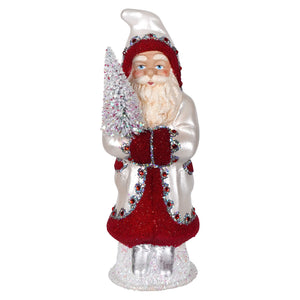 A festive ino schaller pearl white and red beaded santa figurine with rhinestones holding a snow-dusted tree