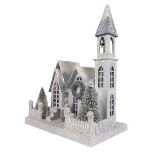Silver glittery metallic church figurine with bell tower wreath and frosted pine trees christmas village church decor
