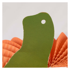 Green fabric dinosaur cutout with a white hole part of jack-o-lantern accordian paper decoration set halloween paper decorations
