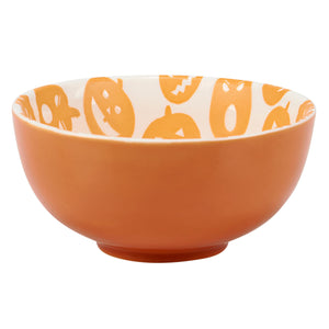 Orange ceramic jack o lantern bowl with white interior featuring pumpkin illustrations in a bowl set