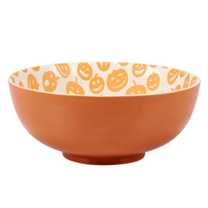 Orange ceramic jack o lantern bowl set with white interior decorated with orange jack o lantern faces