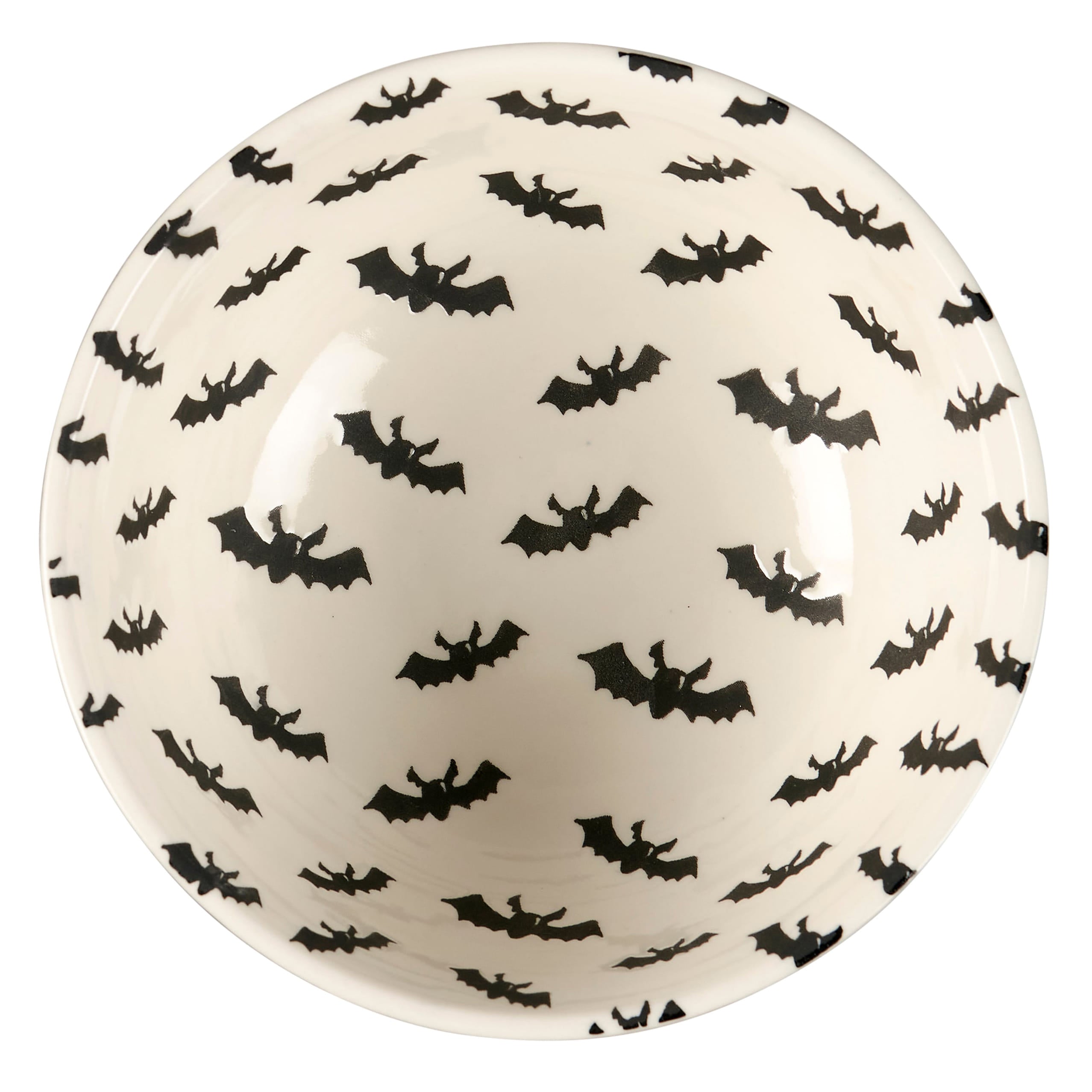 A white ceramic jack o lantern bowl with black bat silhouettes in a spooky bowl set perfect for halloween